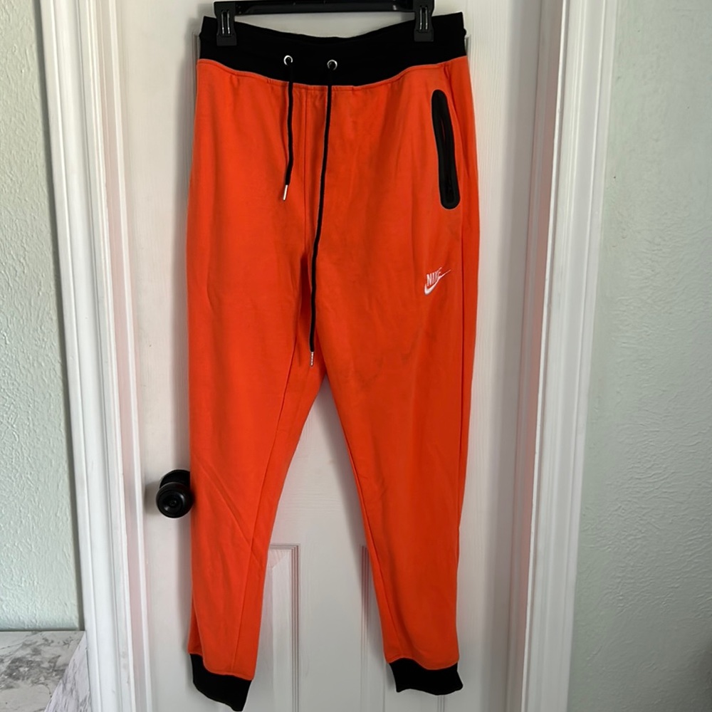 Nike tech pants orange and black never worn new no tears or marks